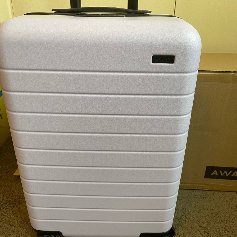 Brand New-Never been used lavender away bigger carry on suitcase